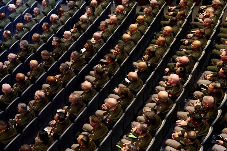 FILE PHOTO: Members of the military attend a meeting convened by U.S. Defense Secretary Pete Hegseth, at Marine Corps Base Quantico, in Quantico, Virginia, U.S., September 30, 2025. REUTERS/Kevin Lamarque   TPX IMAGES OF THE DAY/File Photo