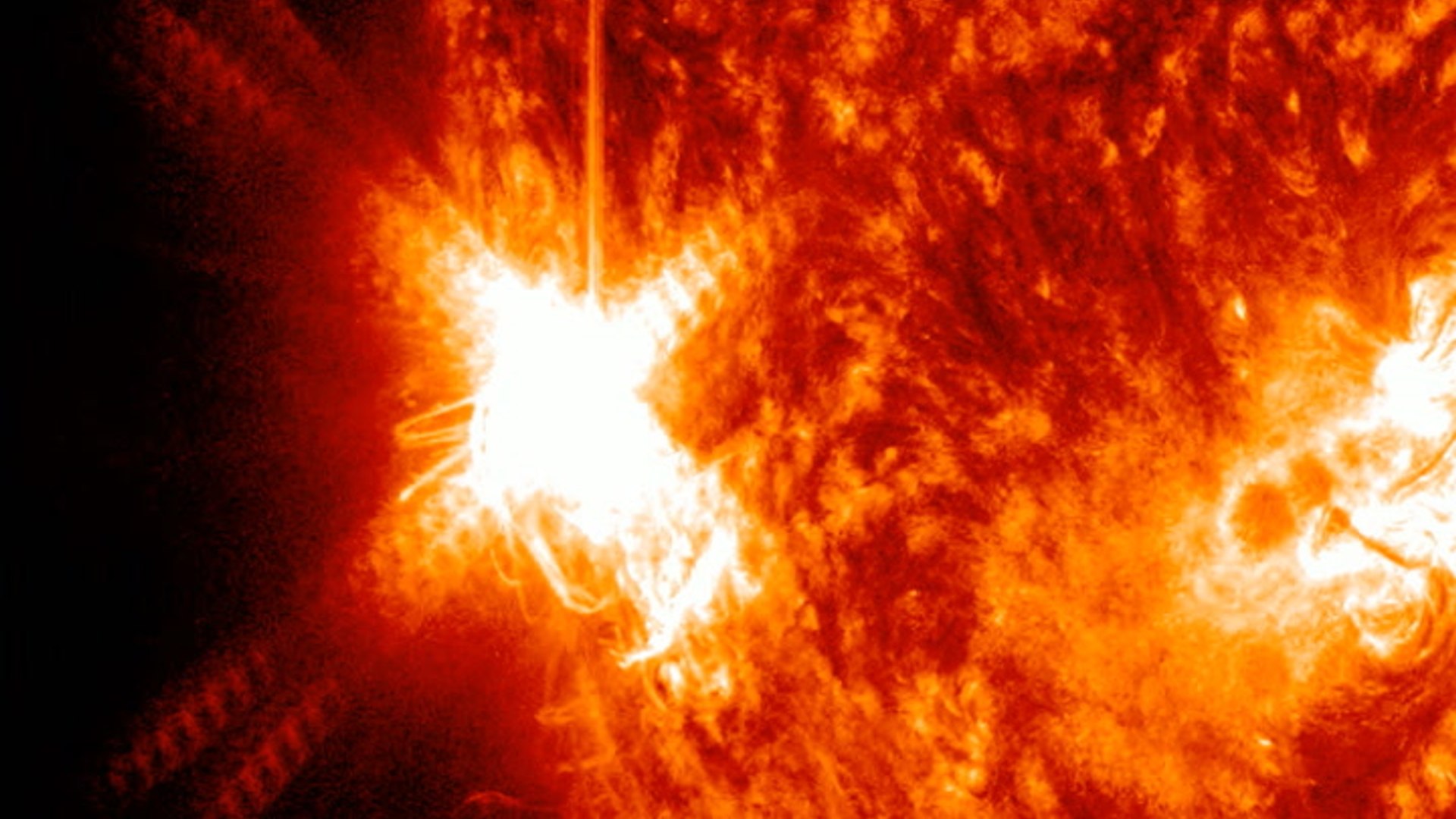 X1.9 solar flare - hyperactive sunspot eruption seen by spacecraft