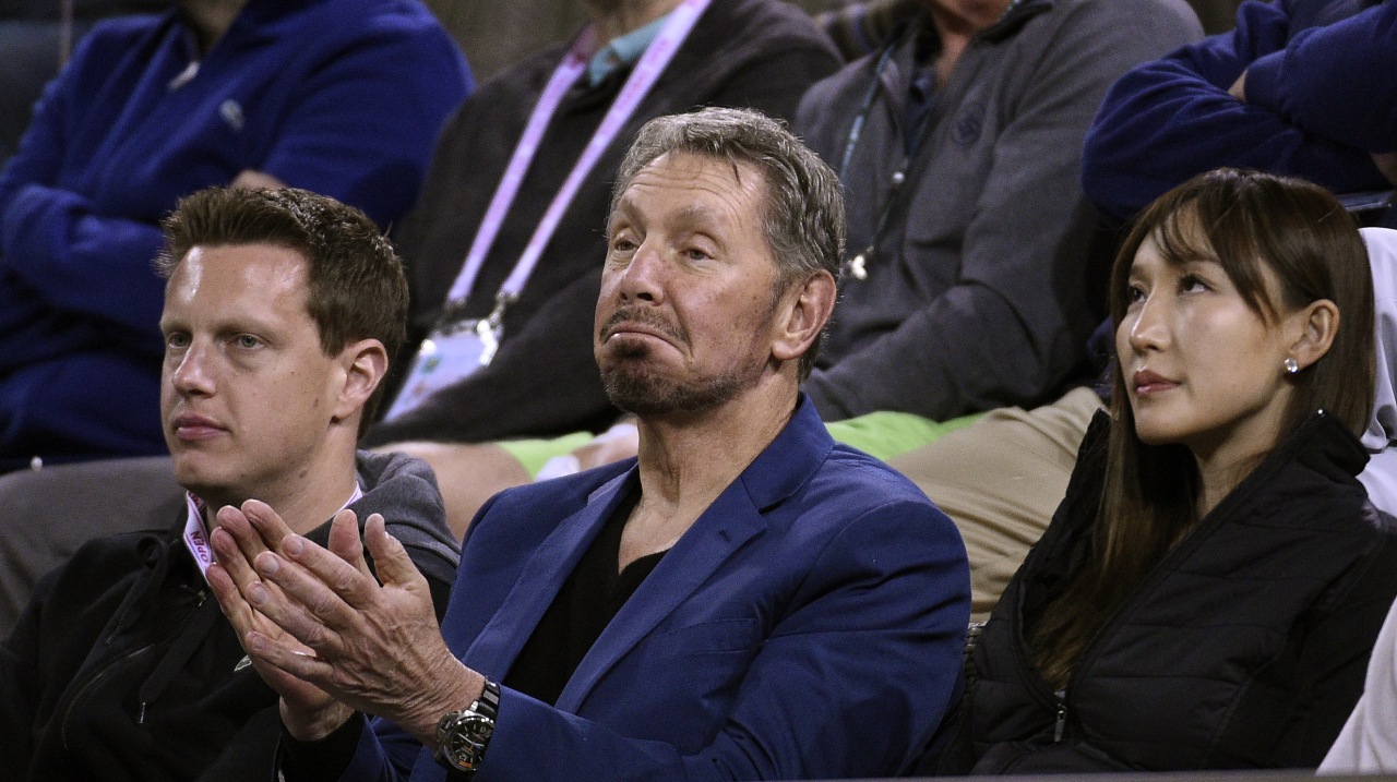 From left, David Ellison, Larry Ellison and Jolin watching the BNP Paribas Open tennis tournament on March 15, 2018, in Indian Wells, Calif.
