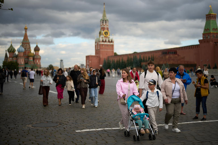 Russians face mounting economic woes as country goes to polls