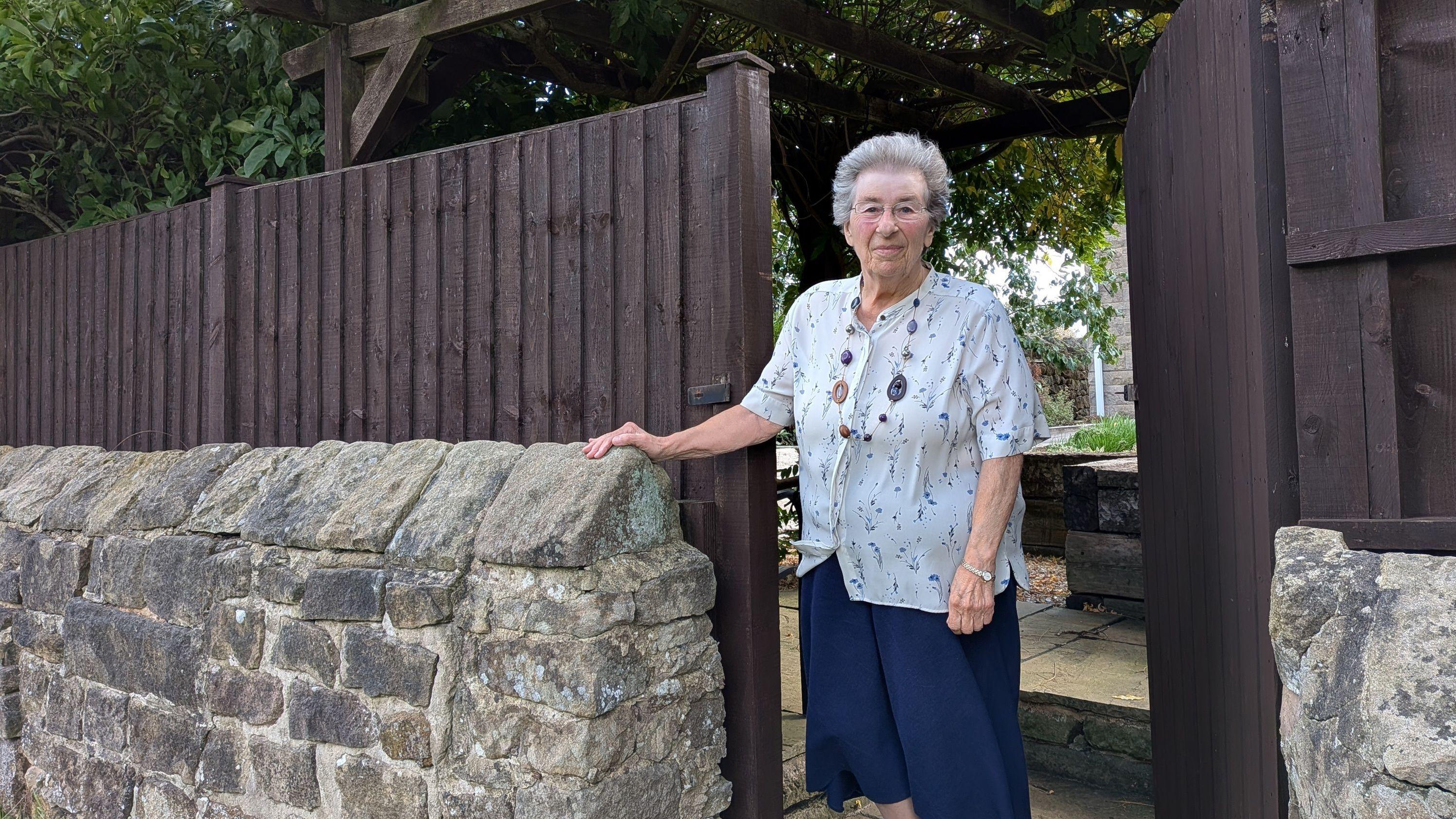 Fenced in woman, 81, wins three-year access fight