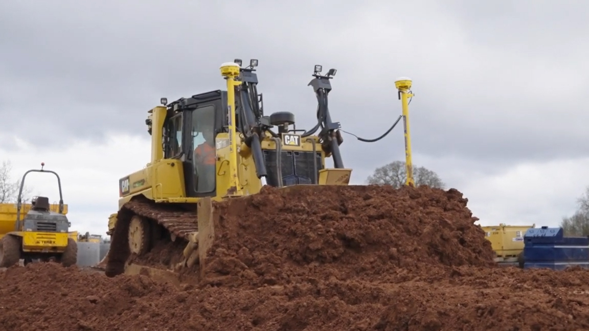 Giant bulldozer moving tons of dirt with incredible power