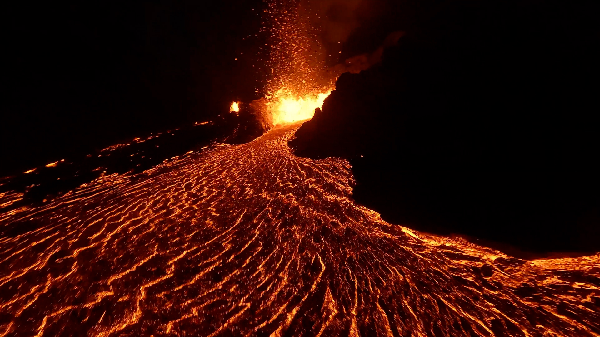 Iceland’s fiery volcanoes and glowing lava seen from above