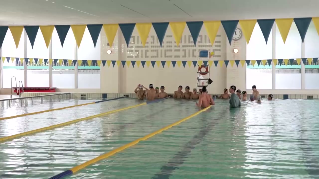 Olympic swimming champion Leon Marchand trains school students in Japan