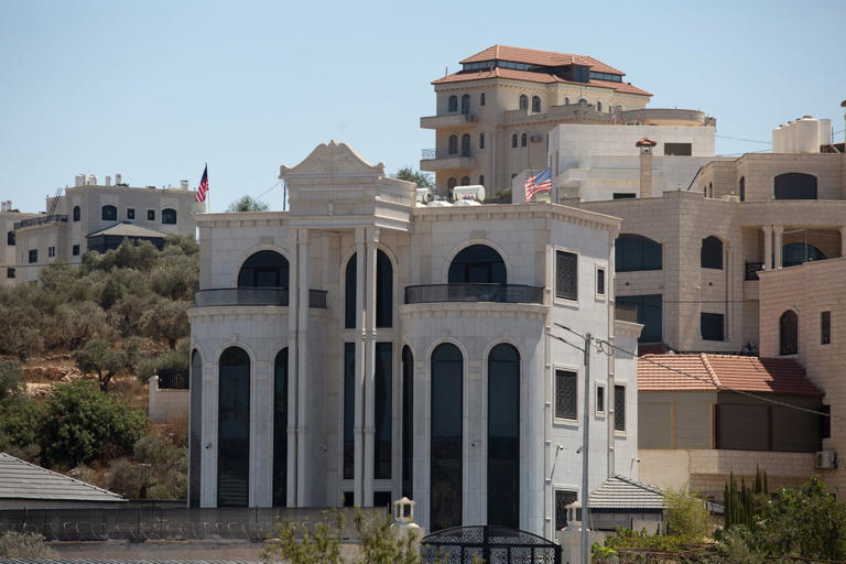 Most of the houses in Turmus Ayya are multi-story villas, many of which fly the American flag. Credit: Itay Cohen