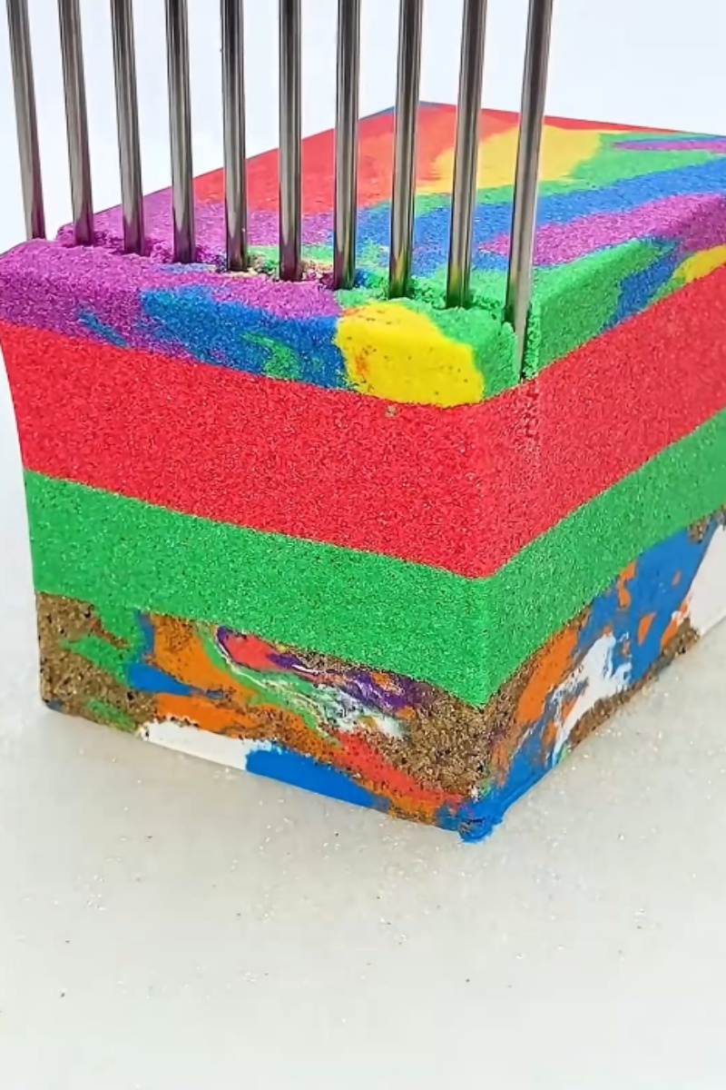 Colorful foam block pierced by metal rods