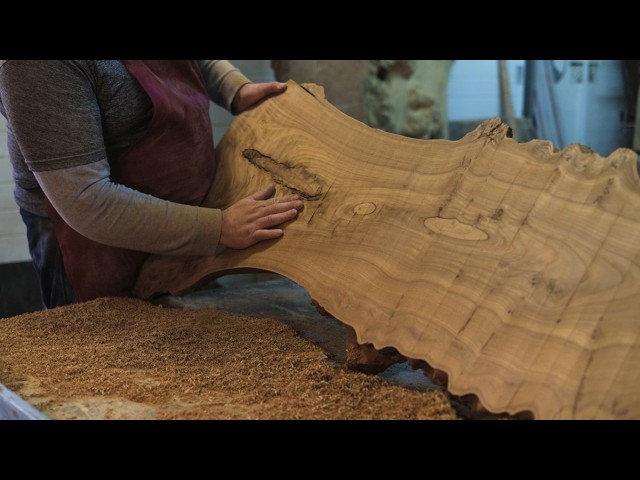 A thick wood slab turned into a coffee table that looks custom built