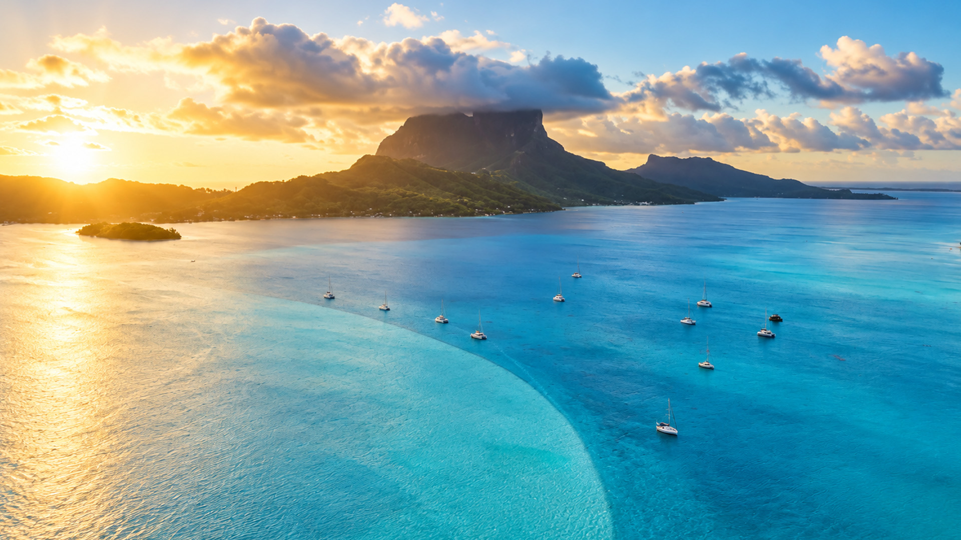 A steep mountain rising from a tropical island