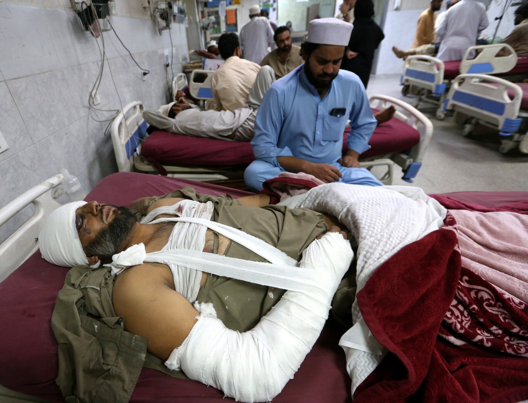 31 dead in Pakistan after suicide bomber, gunmen attack police complex