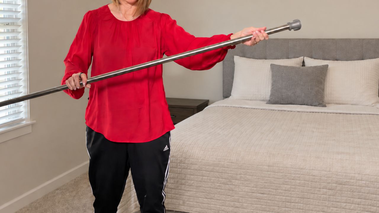 Hang a tension rod in your bedroom (this is brilliant)