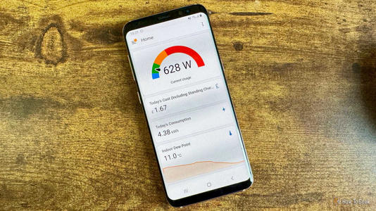 Home Assistant Home dashboard on an Android phone showing a current power usage gauge todays cost and indoor dew point.