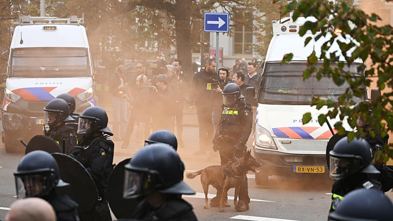Police clash with far-right protesters at anti-immigration rally in The ...