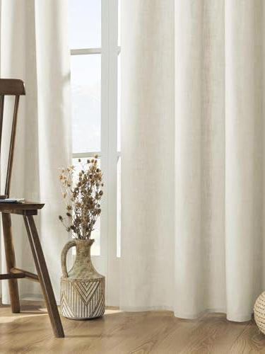 Chrissy Teigen's warm minimalist living room is a masterclass in ...