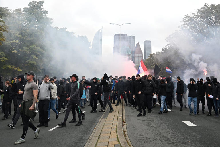 Dutch riot police break up far-right protest in The Hague after ...