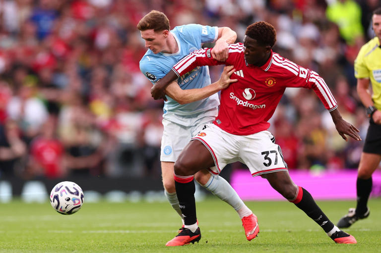 Elliot Anderson battles Kobbie Mainoo for the ball in the Manchester derby earlier this month - Getty Images/Shaun Brooks
