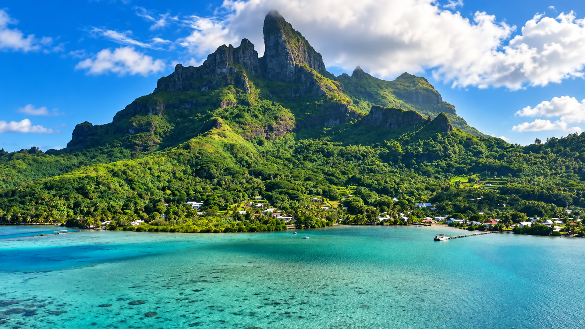 Villages spread beneath a massive volcanic mountain