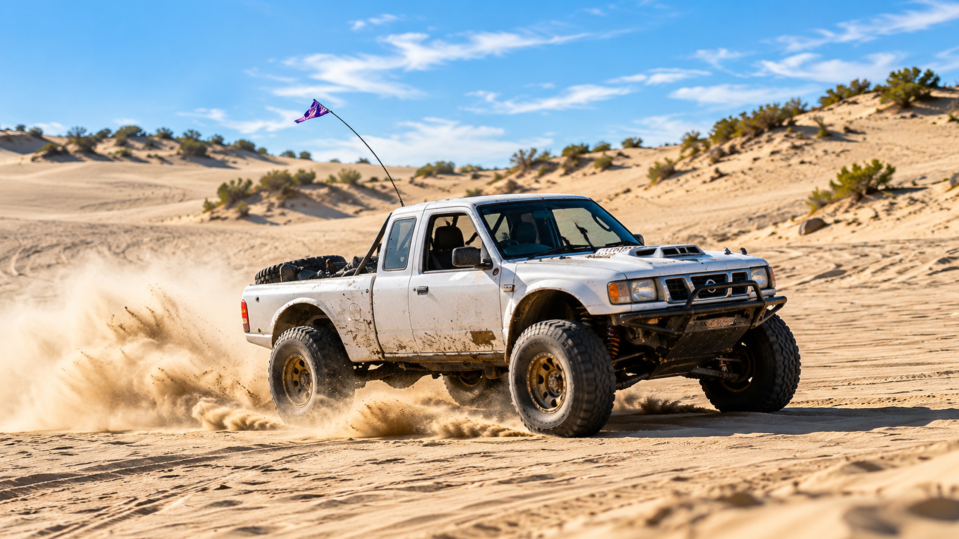 A prerunner takes on Glamis Dunes without proper sand tires