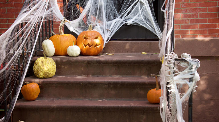 DIY a pool noodle candy corn wreath to spruce up your porch for fall