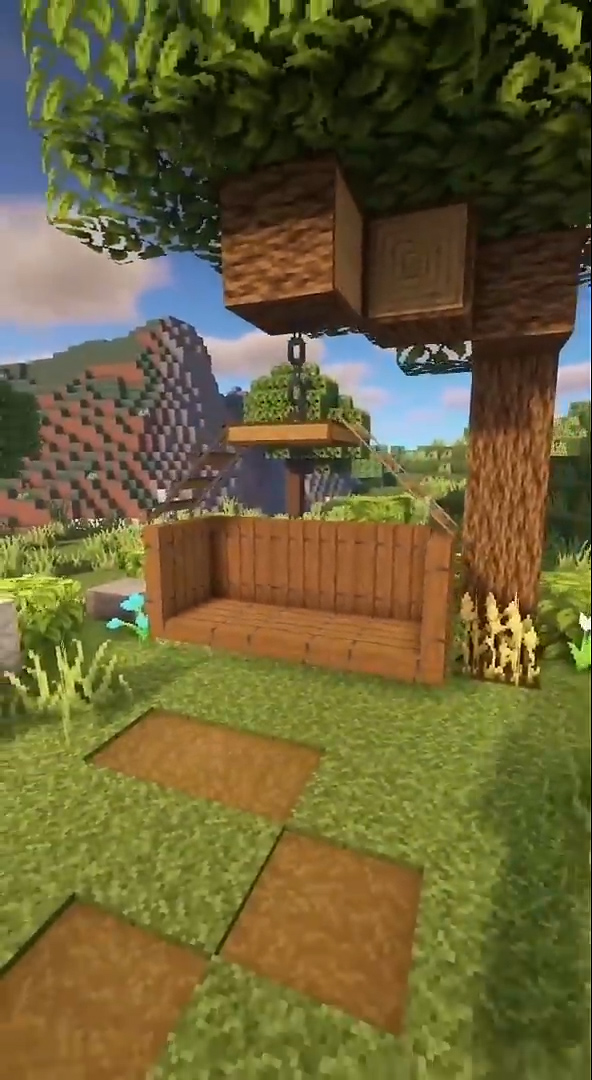 A beautiful hanging bench hidden beneath a Minecraft tree