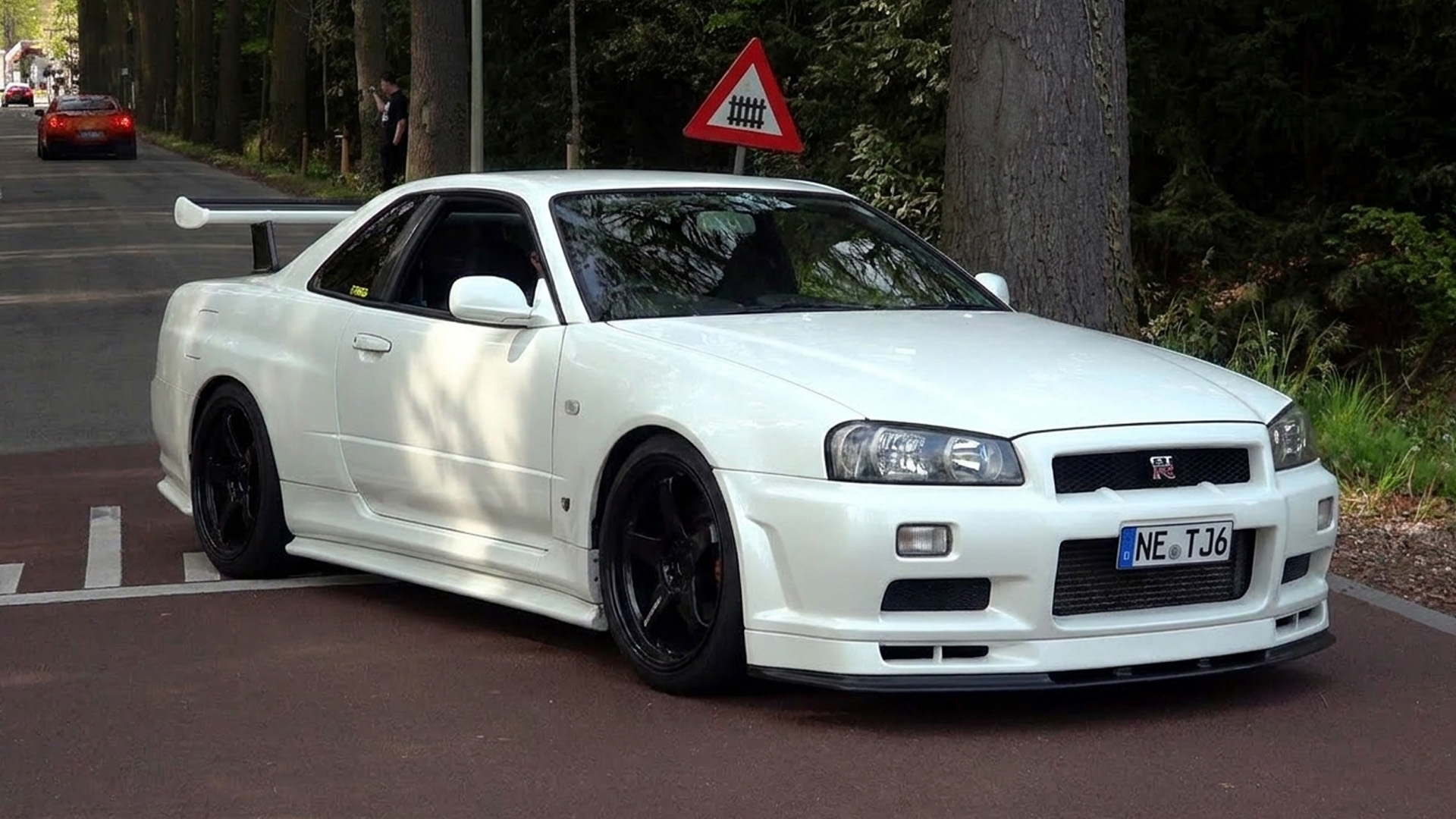 Nissan Skyline GT-R R34 joins a gathering of modified GT-Rs
