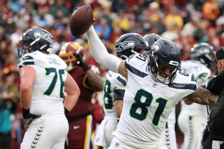 Seattle Seahawks tight end Eric Saubert reacts after scoring a touchdown against the Washington Commanders. | IMAGN IMAGES via Reuters Connect