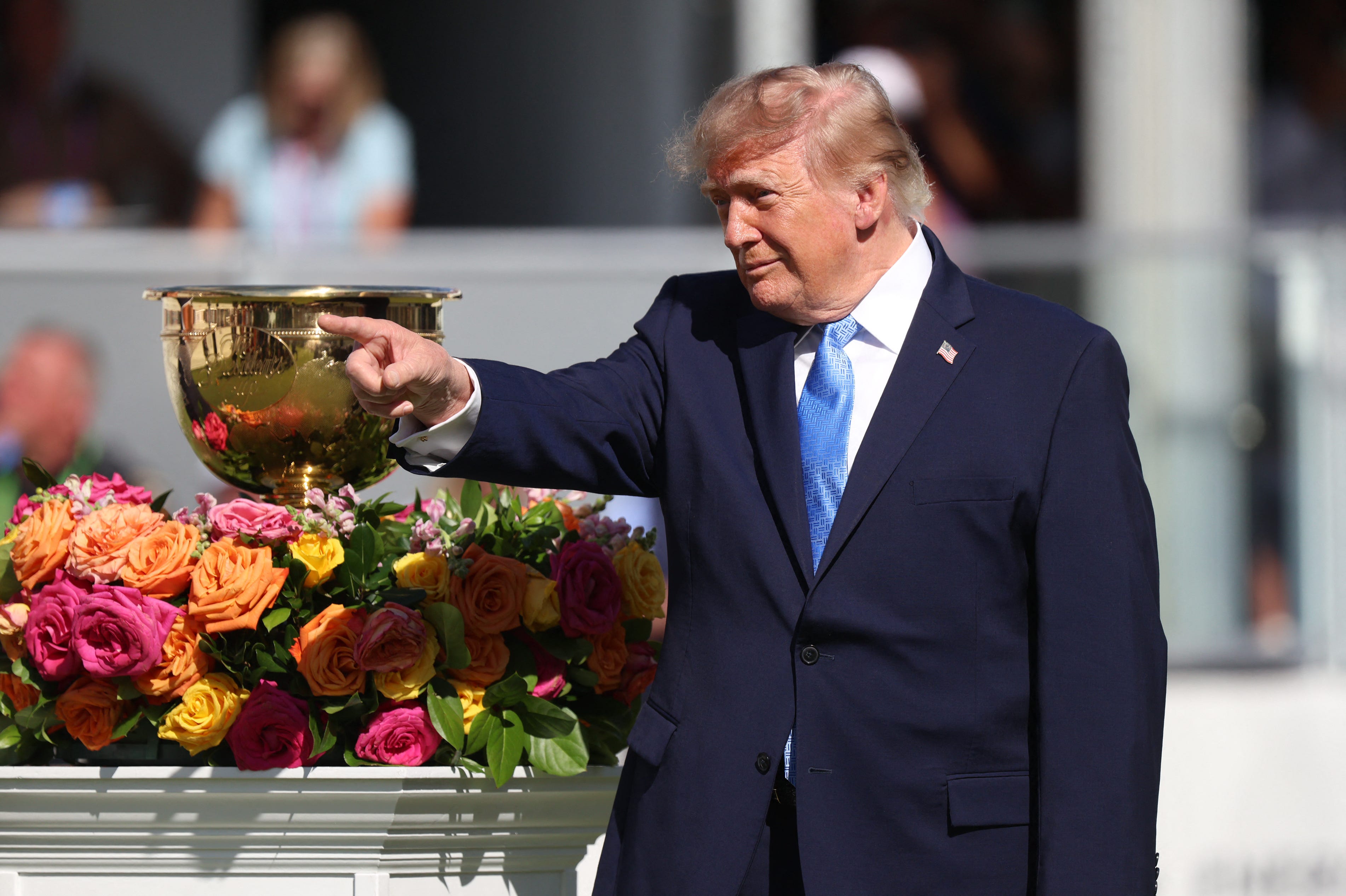 Donald Trump receives warm welcome during brief remarks at Presidents Cup