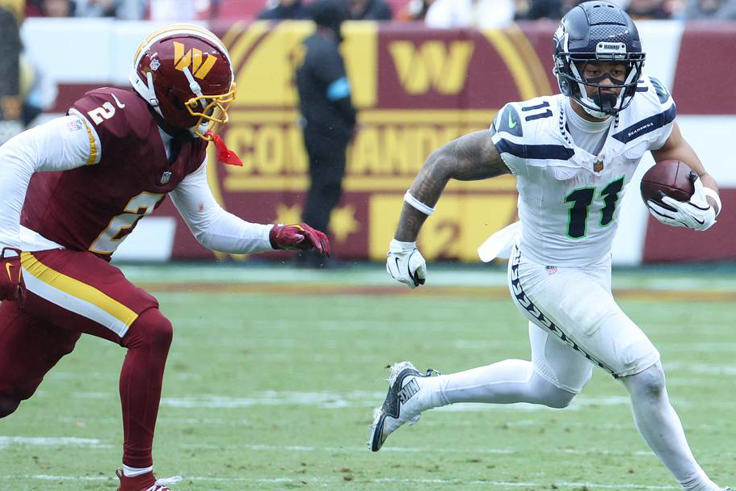 Seattle Seahawks wide receiver Jaxon Smith-Njigba makes a catch against Washington Commanders cornerback Amik Robertson. | IMAGN IMAGES via Reuters Connect