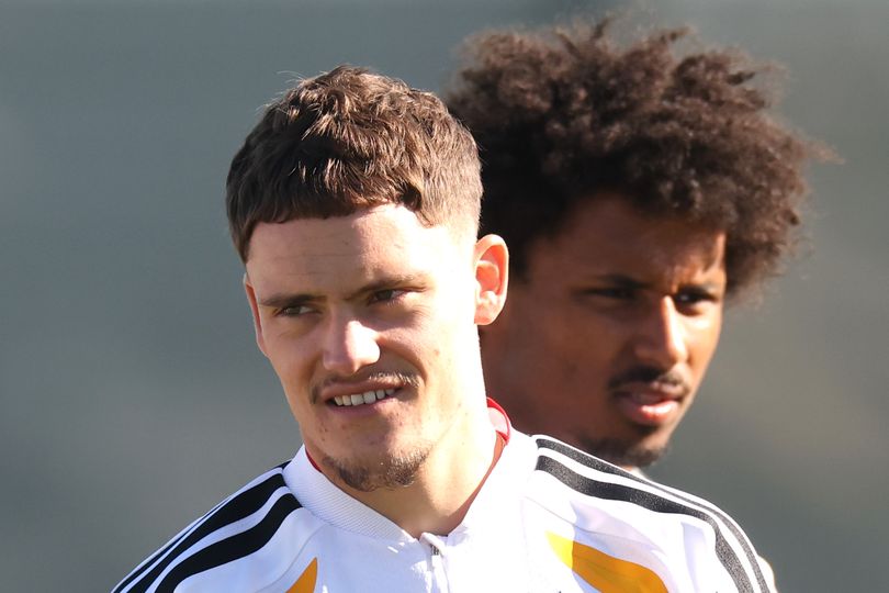 Florian Wirtz (L) looks on with team mate Karim Adeyemi during a Team Germany training session