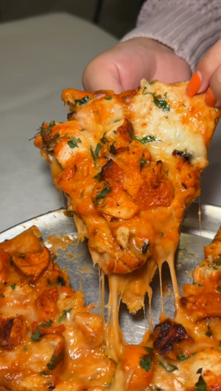 Chicken tikka naan pizza with Indian fusion flavors