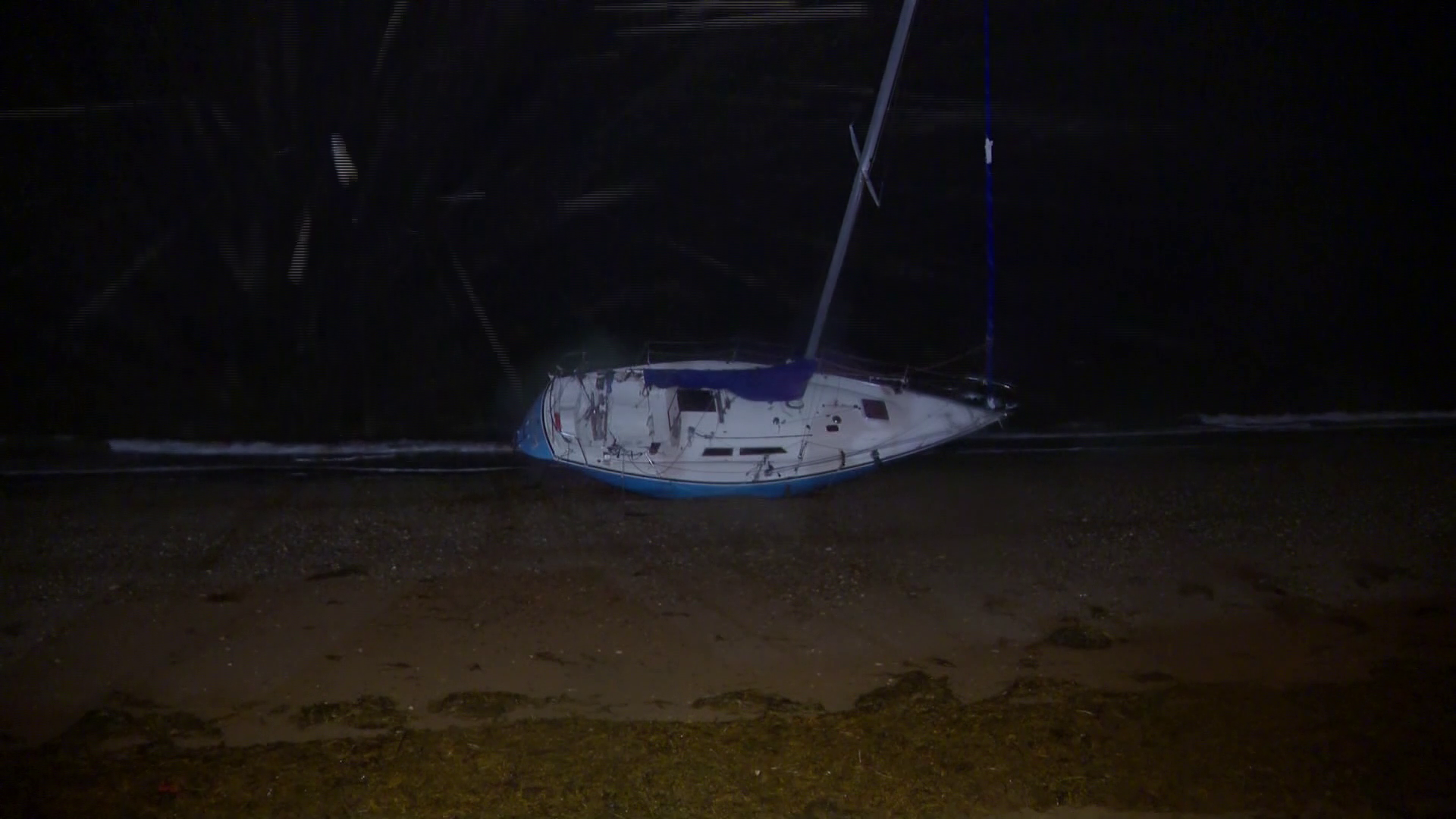 Sailboat washes ashore on Quincy beach