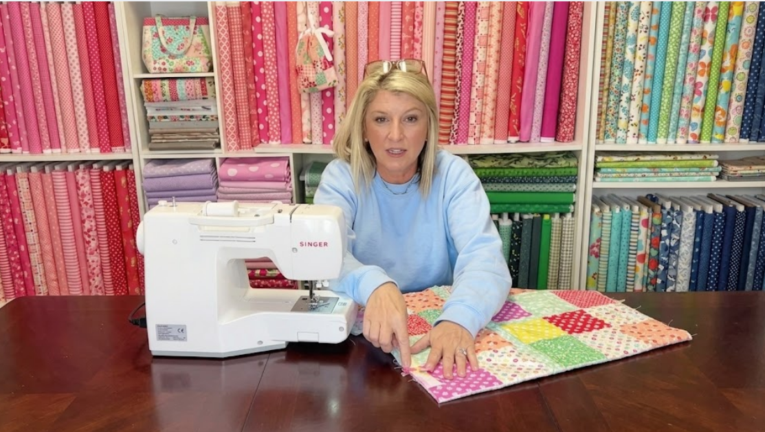 Learn the tricks behind beautiful doll quilt binding