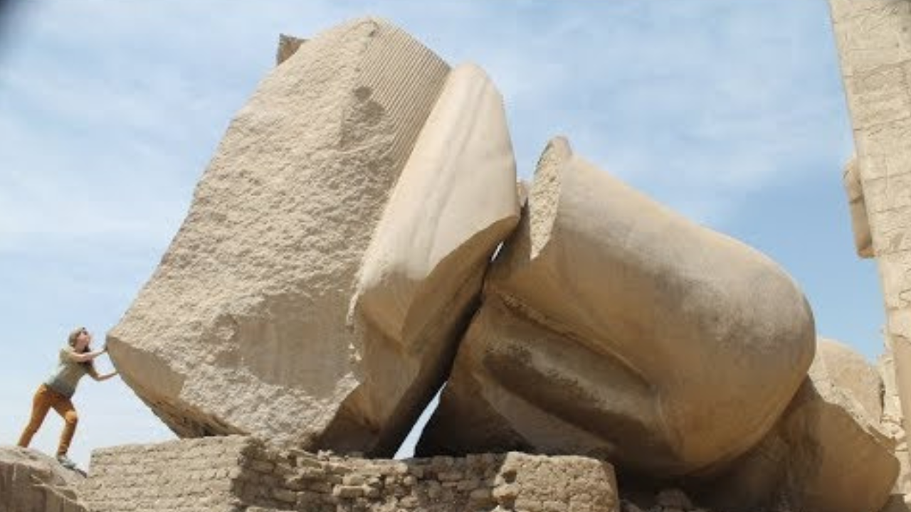 Large statues near Luxor in Egypt display visible damage