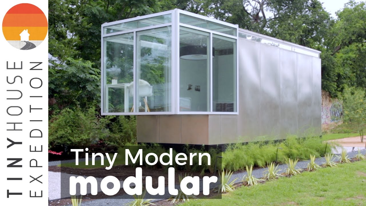 Sleek modern modular tiny house inspired by converted dumpster