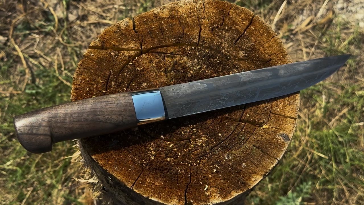 This Damascus knife started as a bundle of steel cable