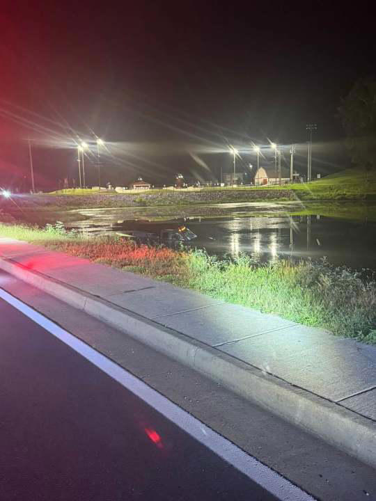 Vehicle crashes into Hurricane reservoir, driver sustains minor injuries