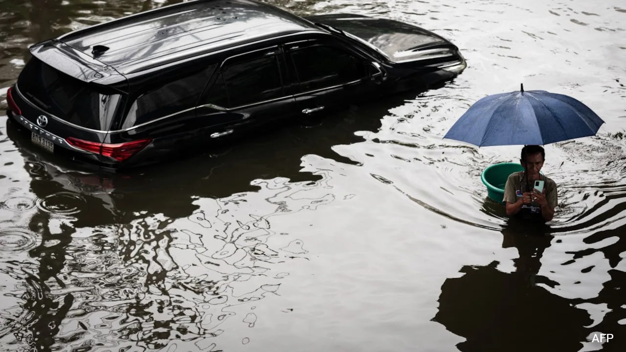 Cars under water, snakes on street: Relentless weekend rain drowns Bangkok