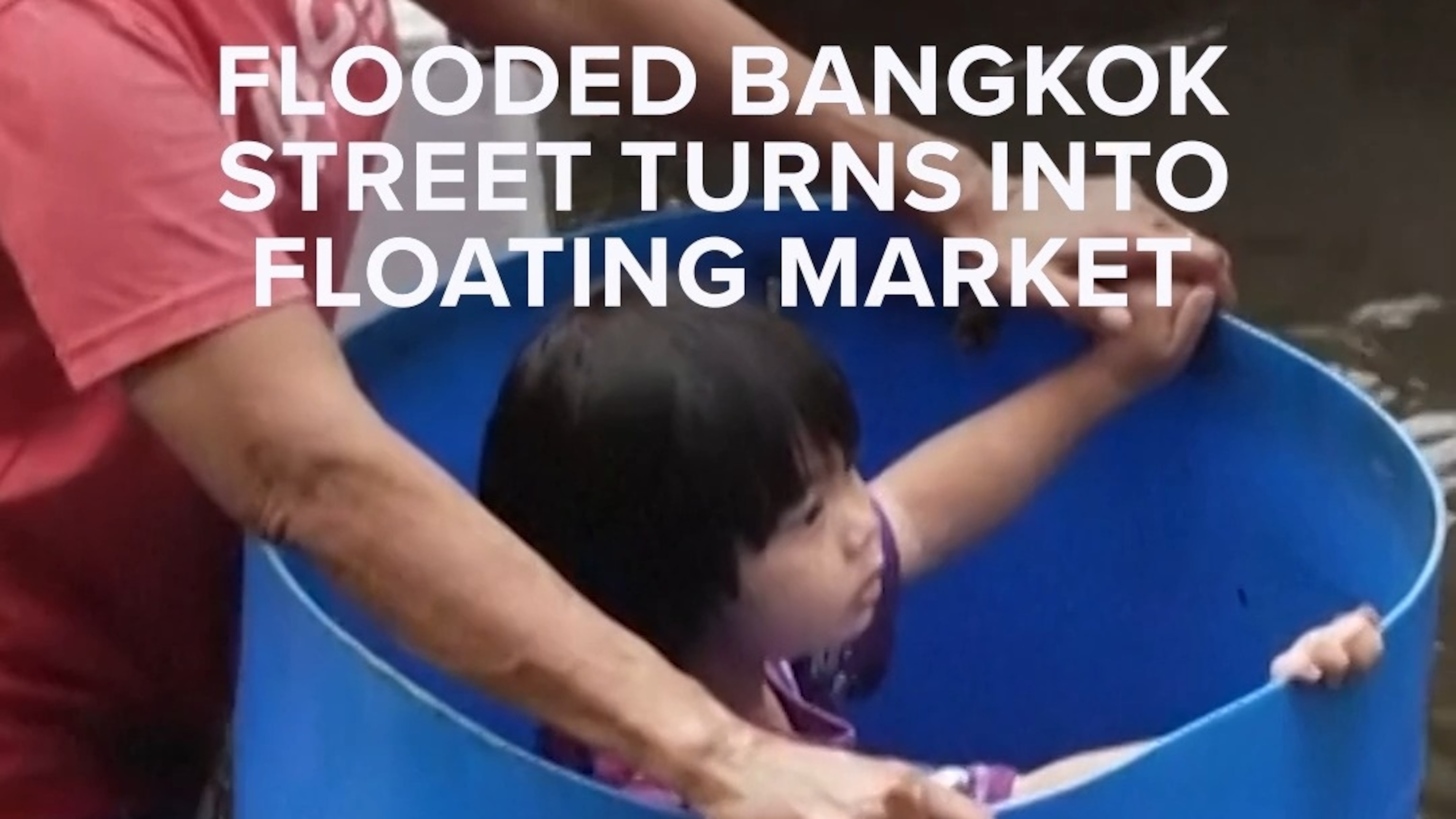 Flooded Bangkok street turns into floating market