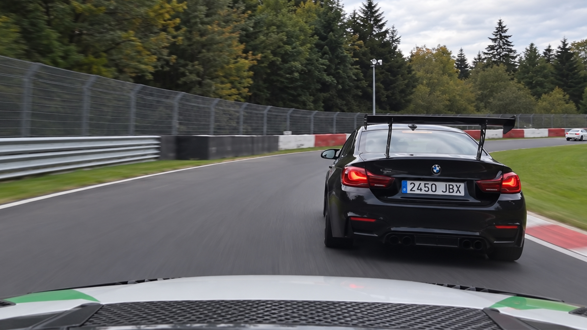 BMW M4 with giant wing hunts down a white car