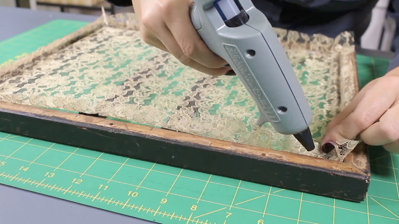 Woman turns lace and an old frame into a charming jewelry holder
