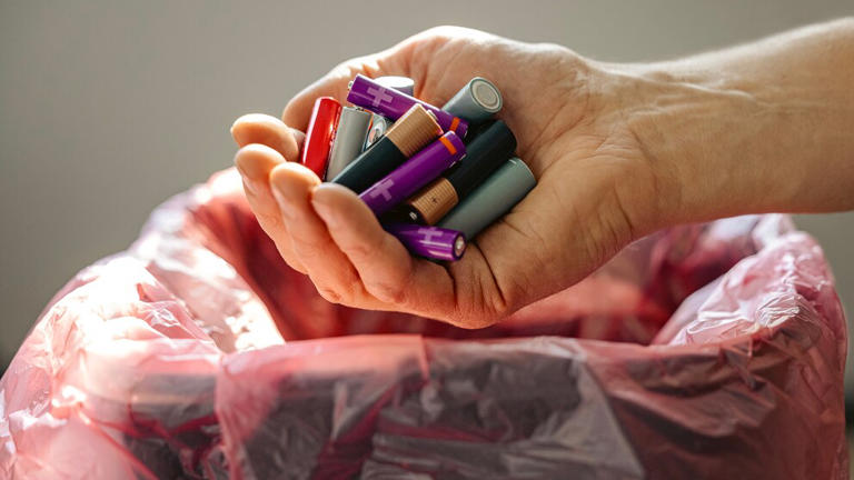 What can happen if you dispose of old batteries in regular trash