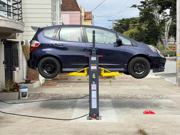 This disappearing driveway lift setup is a next-level home mechanic move