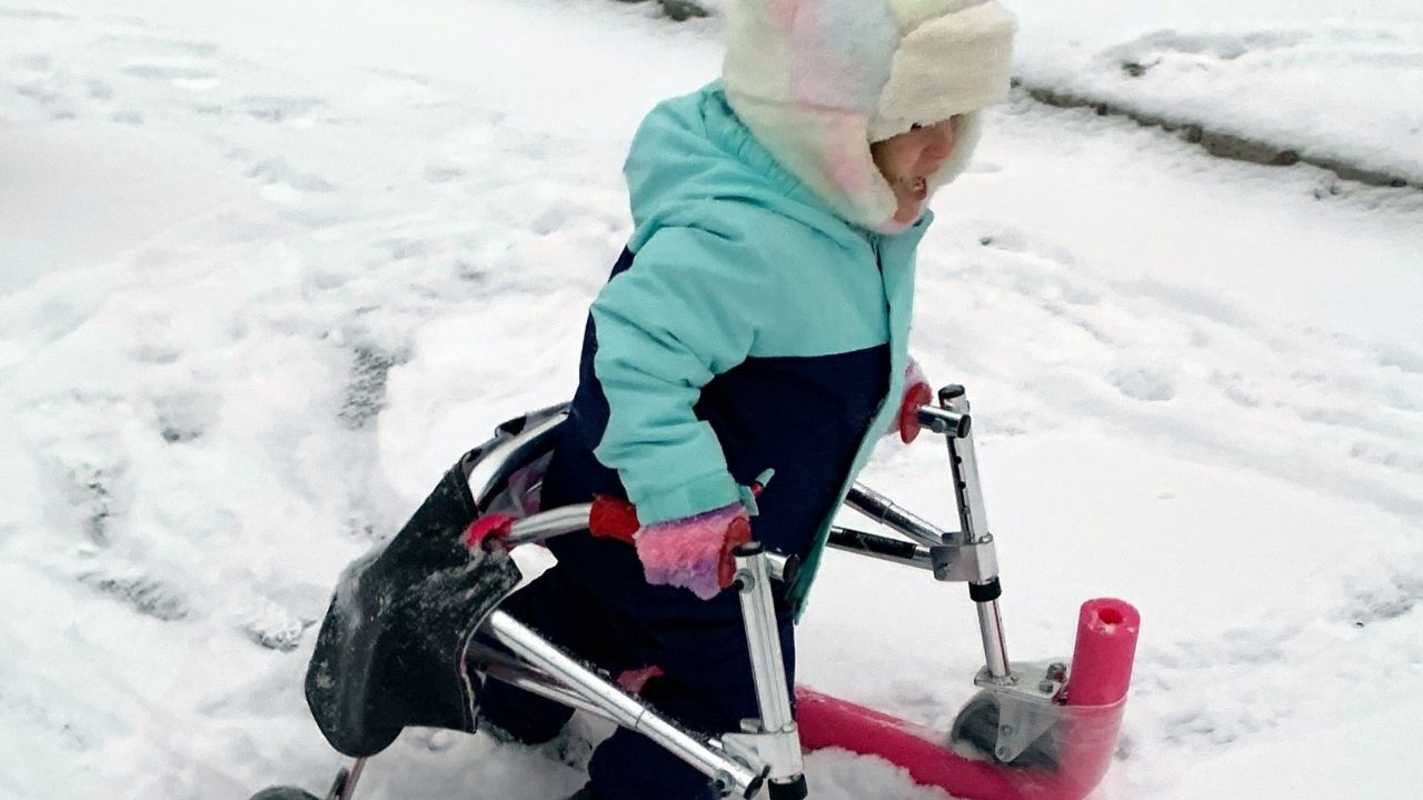 Girl told she may never walk plays in snow thanks to ingenious hack ...
