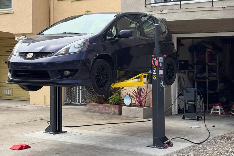 This disappearing driveway lift setup is a next-level home mechanic move
