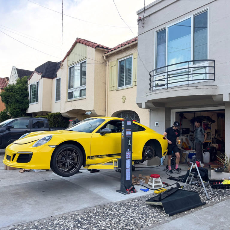 This disappearing driveway lift setup is a next-level home mechanic move