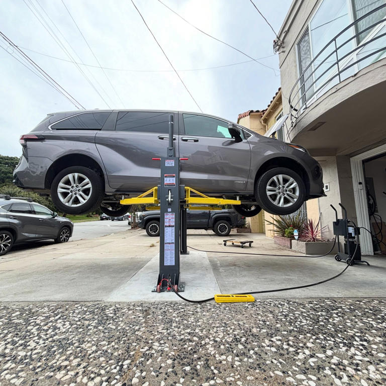 This disappearing driveway lift setup is a next-level home mechanic move