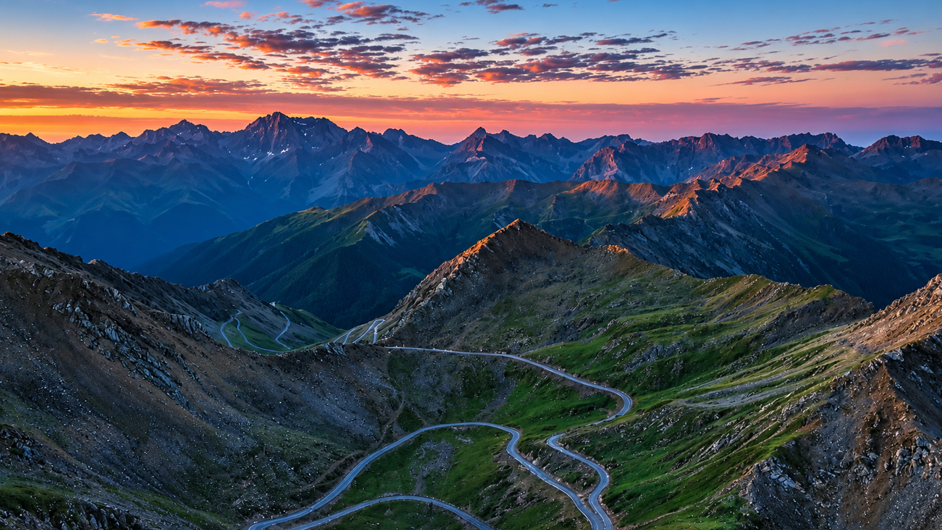 A narrow road between rugged mountain peaks