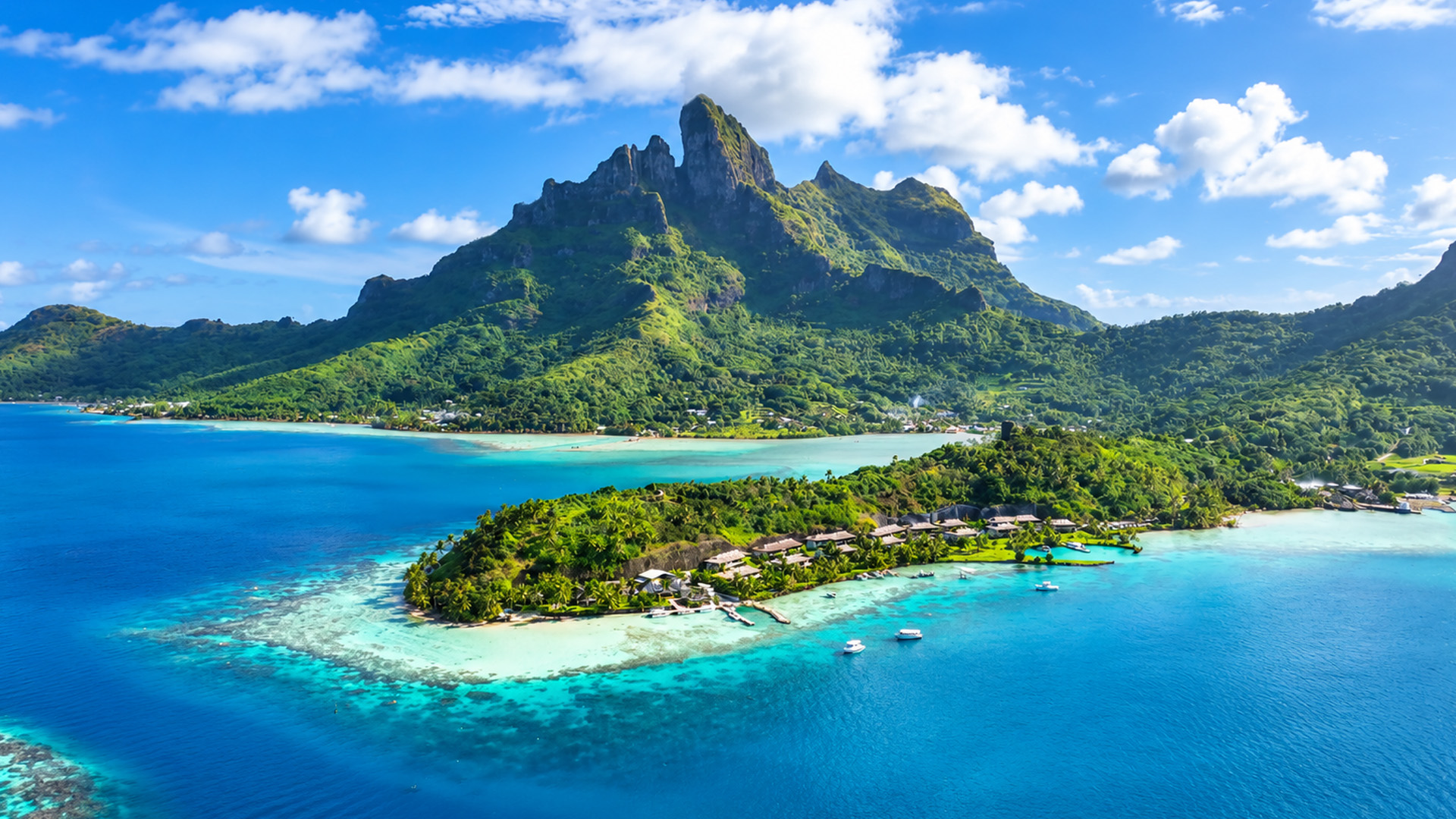 Coral reefs frame Bora Bora’s mountain landscape