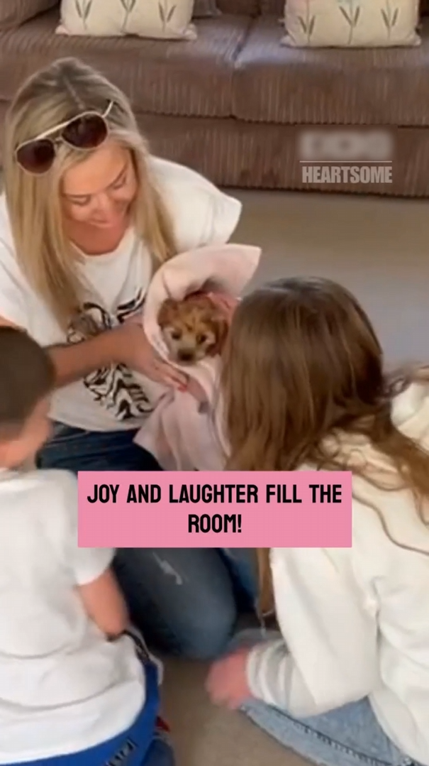 Children's joyful response to unexpected arrival of new puppy