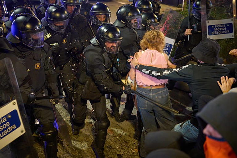 Barcelona housing protest erupts into clashes as barricades burn