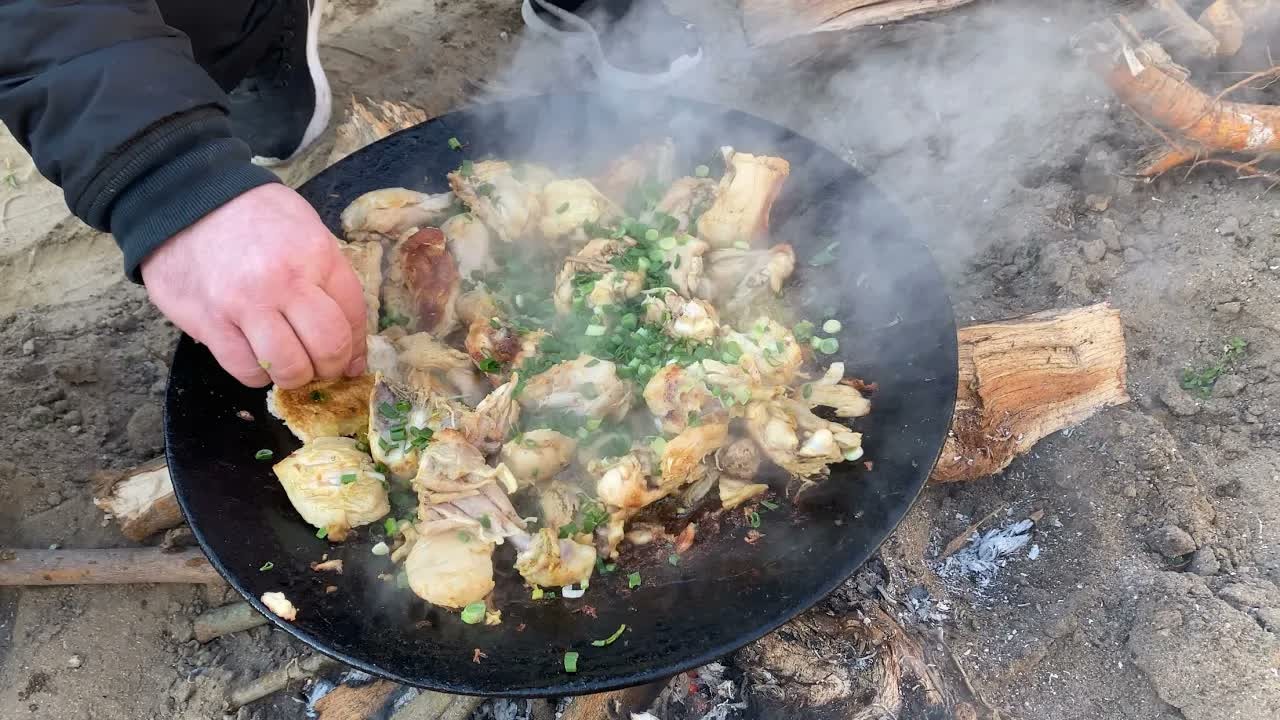 I cooked drunk chicken over a campfire with a mountain of fresh vegetables